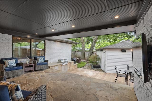 11641 Sasanqua Ln, Dallas, TX 75218 - view of patio featuring an outdoor kitchen, fence, grilling area, and an outdoor hangout area