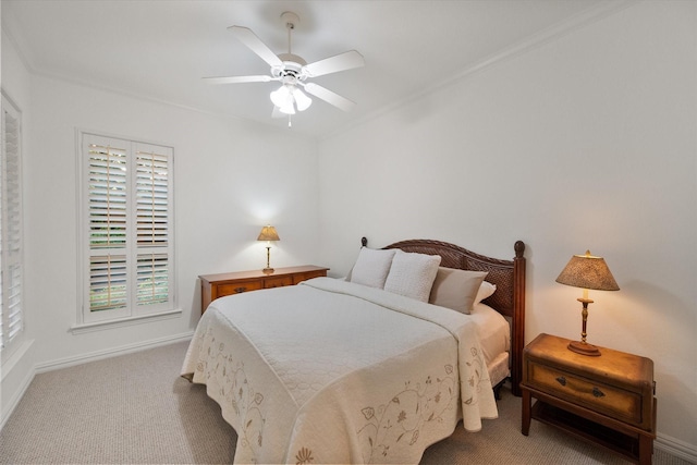 carpeted bedroom featuring baseboards and a ceiling fan