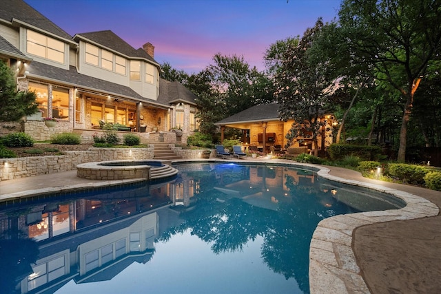 520 Round Hollow Ln, Southlake, TX 76092 - pool at dusk featuring a patio, stairway, and a pool with connected hot tub