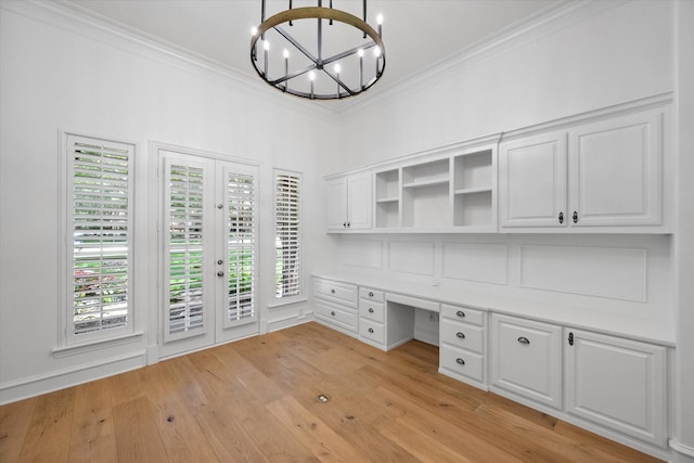 520 Round Hollow Ln, Southlake, TX 76092 - unfurnished office with built in desk, crown molding, a chandelier, and light wood-style flooring