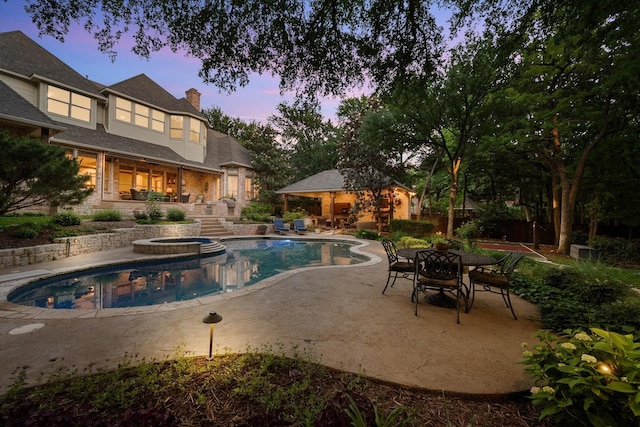 520 Round Hollow Ln, Southlake, TX 76092 - view of swimming pool featuring a patio area, an outbuilding, and a pool with connected hot tub