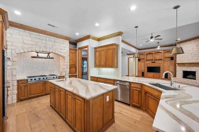 520 Round Hollow Ln, Southlake, TX 76092 - kitchen with stainless steel appliances, ceiling fan, open floor plan, decorative backsplash, and ornamental molding