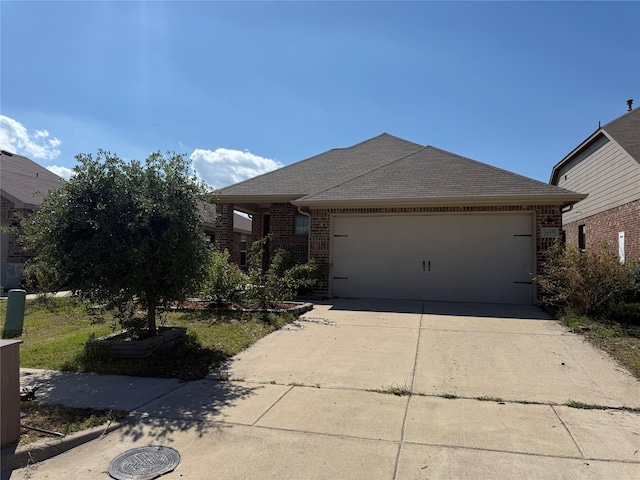 1659 Timpson Dr, Forney, TX 75126 - ranch-style home featuring an attached garage, driveway, brick siding, and a shingled roof