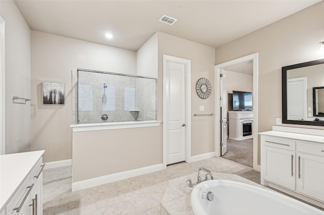 810 Brenda Dr, Mansfield, TX 76063 - bathroom featuring a walk in shower, vanity, a bath, and baseboards