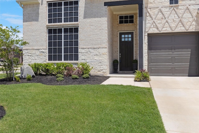 810 Brenda Dr, Mansfield, TX 76063 - doorway to property with a yard, concrete driveway, and stone siding