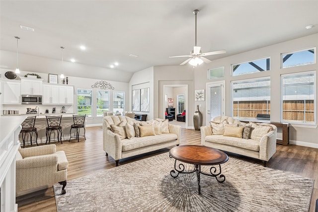 810 Brenda Dr, Mansfield, TX 76063 - living area featuring light wood-type flooring, a ceiling fan, baseboards, lofted ceiling, and recessed lighting