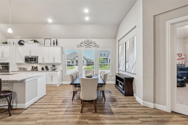 810 Brenda Dr, Mansfield, TX 76063 - dining area with light wood-style floors, recessed lighting, baseboards, and lofted ceiling