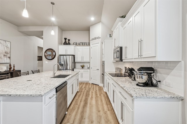 810 Brenda Dr, Mansfield, TX 76063 - kitchen with appliances with stainless steel finishes, a sink, white cabinetry, backsplash, and recessed lighting