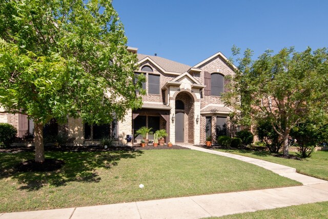 6001 Lacebark Elm Dr, Fort Worth, TX 76123 - view of front facade featuring brick siding and a front lawn
