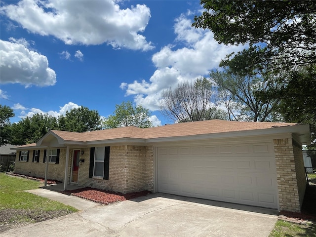 6706 Frontage Rd, Greenville, TX 75402 - single story home with brick siding, a garage, and concrete driveway