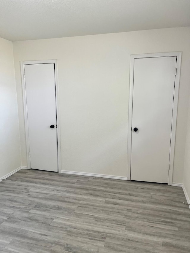 6706 Frontage Rd, Greenville, TX 75402 - empty room featuring baseboards and light wood-style floors