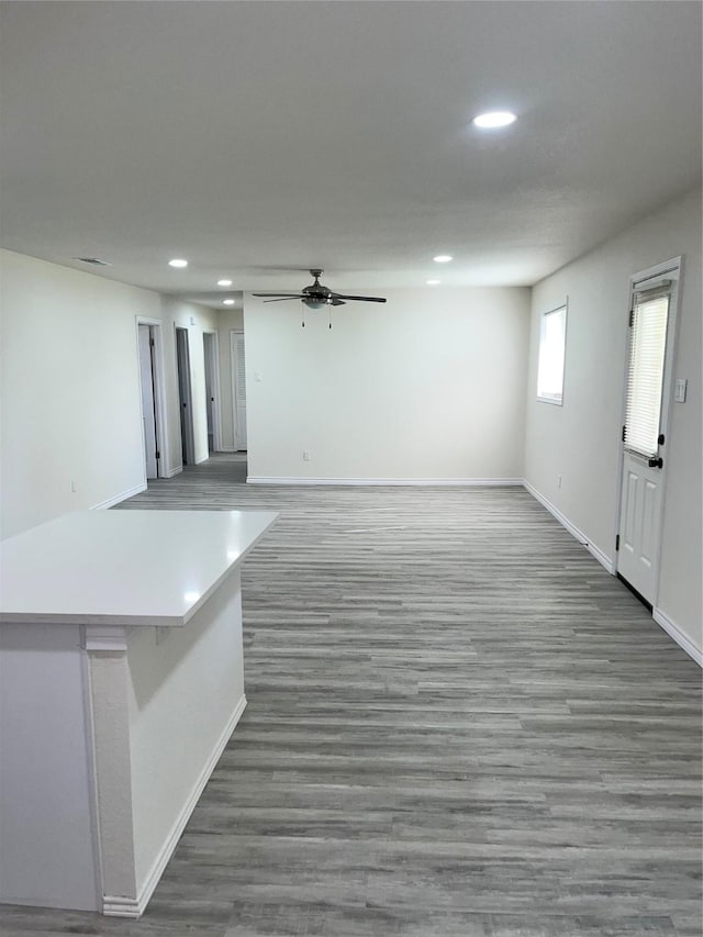 6706 Frontage Rd, Greenville, TX 75402 - basement featuring ceiling fan, baseboards, recessed lighting, and wood finished floors