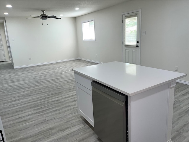 6706 Frontage Rd, Greenville, TX 75402 - kitchen featuring light countertops, light wood-type flooring, recessed lighting, a ceiling fan, and baseboards