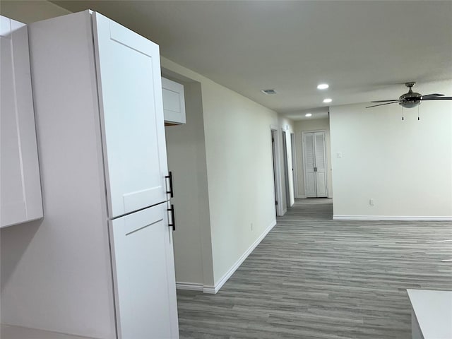 6706 Frontage Rd, Greenville, TX 75402 - hall featuring baseboards, recessed lighting, and wood finished floors
