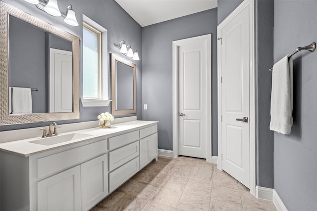 3713 Adelaide, The Colony, TX 75056 - bathroom featuring vanity and baseboards