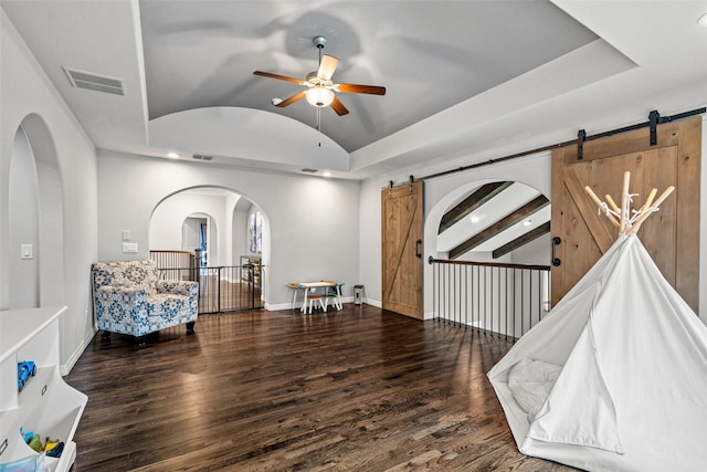 3713 Adelaide, The Colony, TX 75056 - sitting room featuring a barn door, vaulted ceiling, a ceiling fan, wood finished floors, and recessed lighting