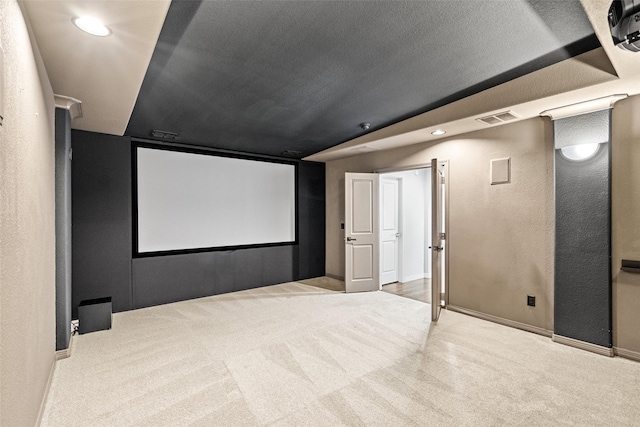 3713 Adelaide, The Colony, TX 75056 - carpeted cinema room with a textured wall, baseboards, and recessed lighting