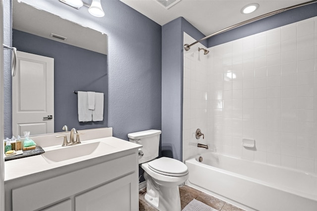 3713 Adelaide, The Colony, TX 75056 - bathroom featuring toilet, a textured wall, tub / shower combination, and vanity