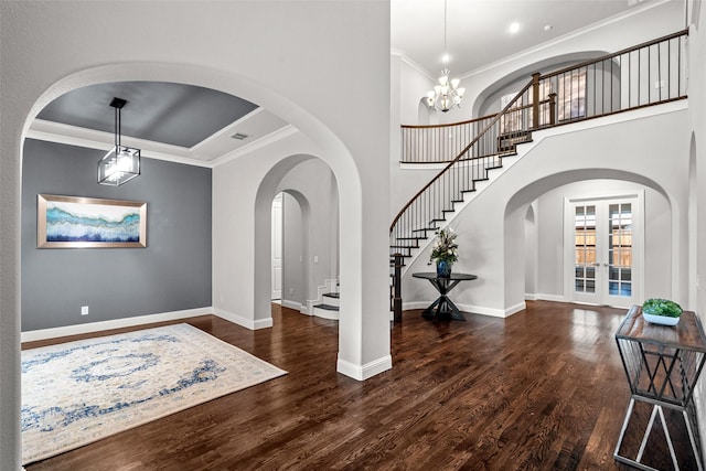 3713 Adelaide, The Colony, TX 75056 - foyer entrance with baseboards, stairs, crown molding, arched walkways, and wood finished floors