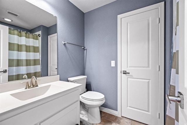 3713 Adelaide, The Colony, TX 75056 - full bathroom with a textured wall, toilet, baseboards, vanity, and curtained shower