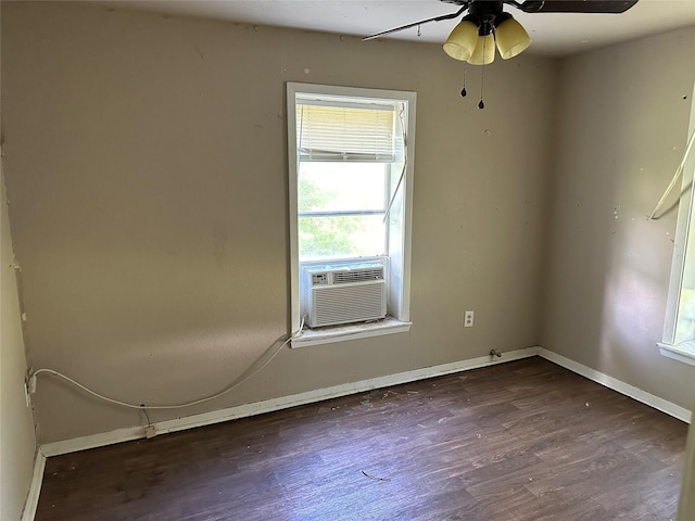 201 N Mount St, Chico, TX 76431 - unfurnished room featuring cooling unit, dark wood-style flooring, baseboards, and ceiling fan