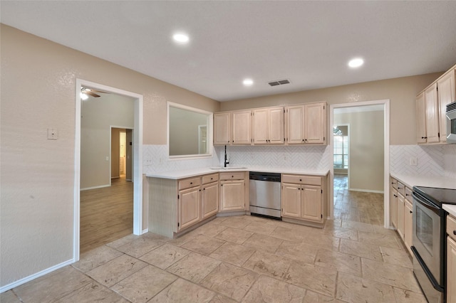 kitchen with appliances with stainless steel finishes, light brown cabinets, light countertops, decorative backsplash, and baseboards
