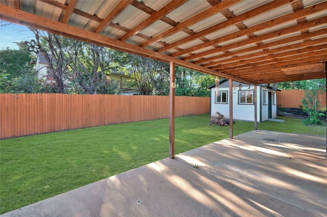 view of yard with a patio area and an outdoor structure