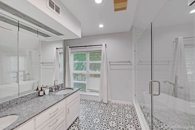 4320 Richmond Ave, Shreveport, LA 71106 - full bathroom with a shower stall, recessed lighting, double vanity, baseboards, and tile patterned flooring