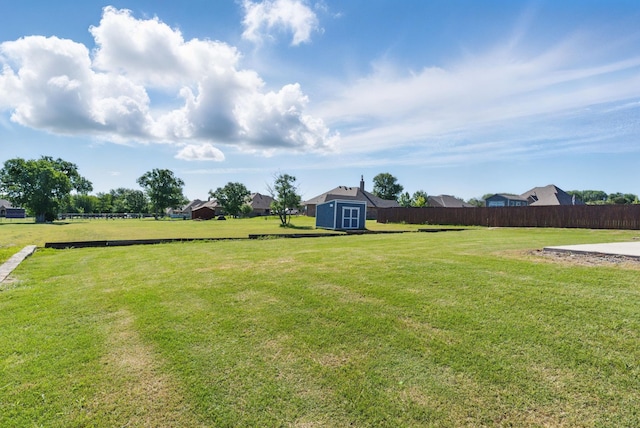 711 Red Stone Ln, Weatherford, TX 76087 - view of yard with an outdoor structure and a storage unit