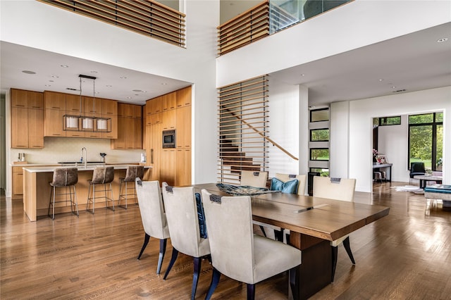 11460 Strait Ln, Dallas, TX 75229 - dining room featuring wood finished floors, recessed lighting, and a high ceiling