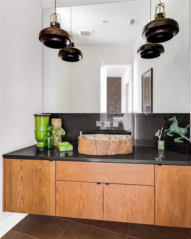 11460 Strait Ln, Dallas, TX 75229 - kitchen featuring dark countertops and dark tile patterned floors