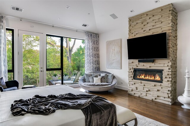 11460 Strait Ln, Dallas, TX 75229 - bedroom with access to outside, wood finished floors, a fireplace, and vaulted ceiling