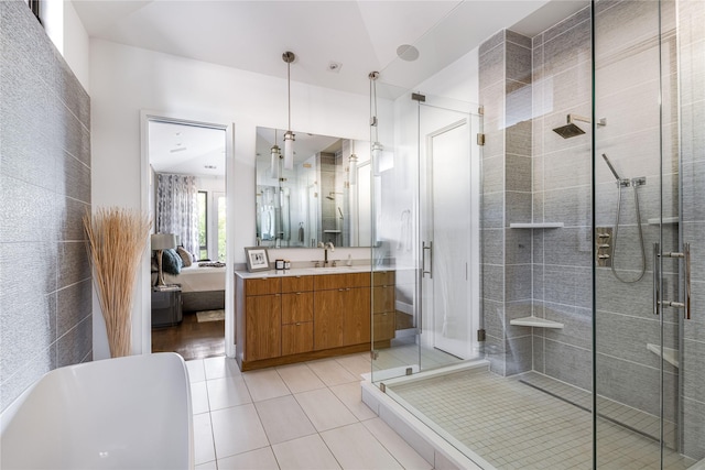 11460 Strait Ln, Dallas, TX 75229 - full bath with a stall shower, vanity, tile patterned floors, and ensuite bath