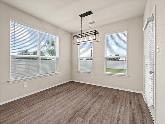 8998 Delway Dr, Providence Village, TX 76227 - unfurnished dining area with wood finished floors and baseboards