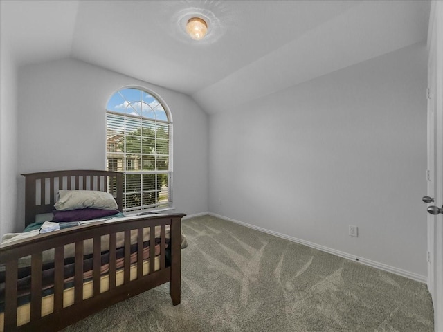 6705 Westover Dr, Rowlett, TX 75089 - carpeted bedroom with vaulted ceiling and baseboards