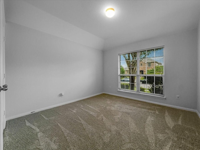 6705 Westover Dr, Rowlett, TX 75089 - carpeted empty room with baseboards and vaulted ceiling