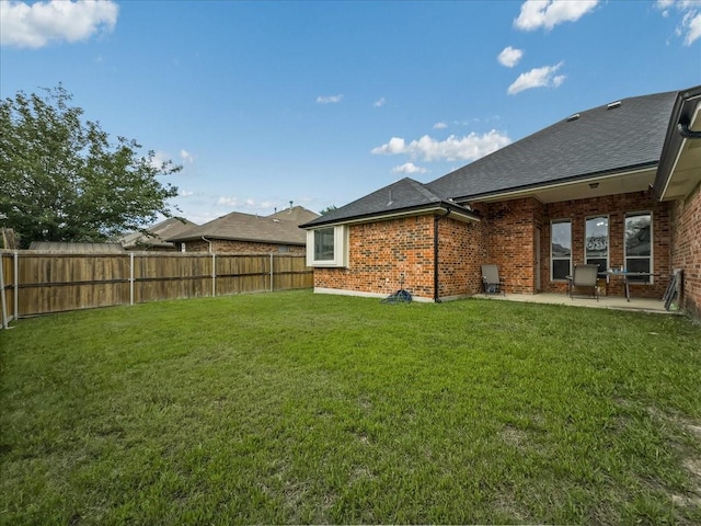 6705 Westover Dr, Rowlett, TX 75089 - rear view of house featuring a patio, brick siding, and roof with shingles