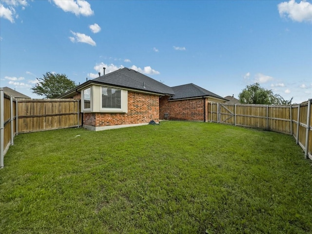 6705 Westover Dr, Rowlett, TX 75089 - back of property with brick siding and a shingled roof