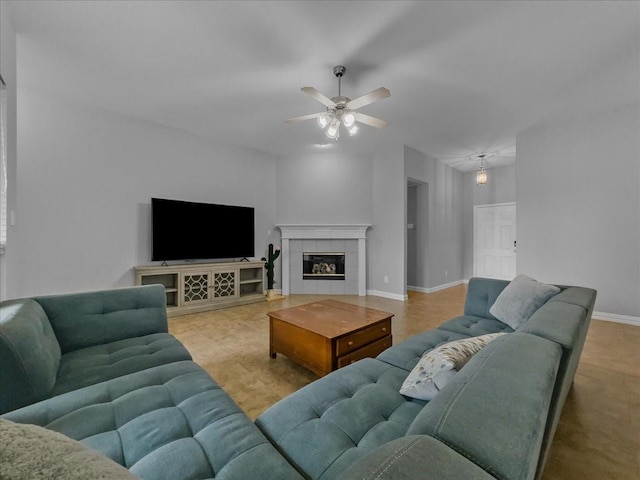 6705 Westover Dr, Rowlett, TX 75089 - living room featuring ceiling fan, baseboards, and a tiled fireplace