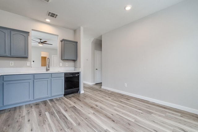4007 Freedom St, Heartland, TX 75126 - kitchen with a sink, dishwasher, baseboards, light wood-style floors, and light countertops