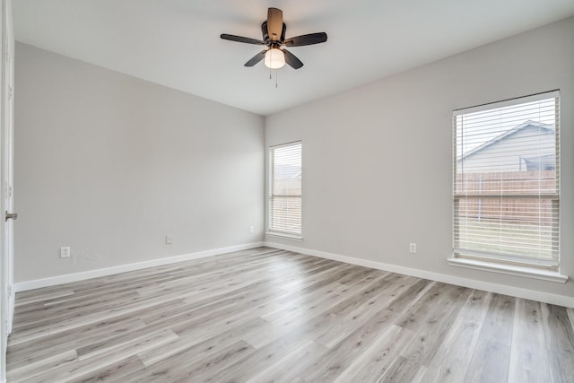 4007 Freedom St, Heartland, TX 75126 - unfurnished room with light wood-type flooring, a ceiling fan, and baseboards
