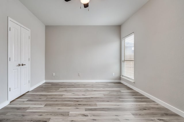4007 Freedom St, Heartland, TX 75126 - unfurnished bedroom with light wood finished floors, baseboards, ceiling fan, and a closet
