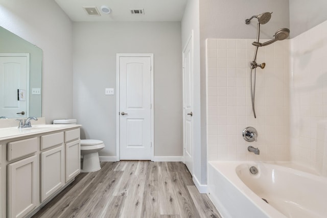 4007 Freedom St, Heartland, TX 75126 - bathroom featuring toilet, wood finished floors, vanity, and shower / tub combination