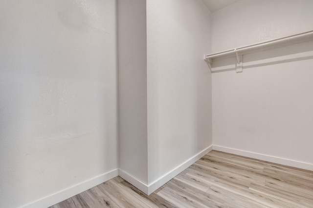 4007 Freedom St, Heartland, TX 75126 - walk in closet featuring light wood-style floors