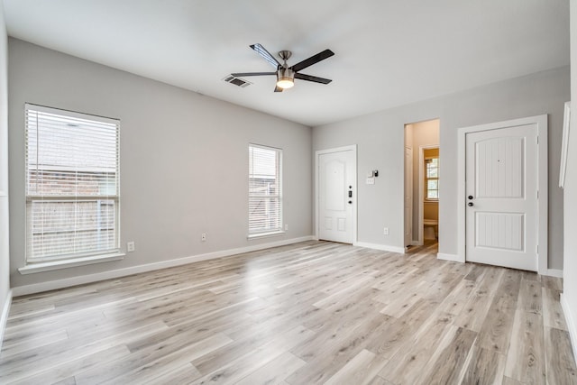 4007 Freedom St, Heartland, TX 75126 - unfurnished living room with ceiling fan, light wood-style floors, and baseboards