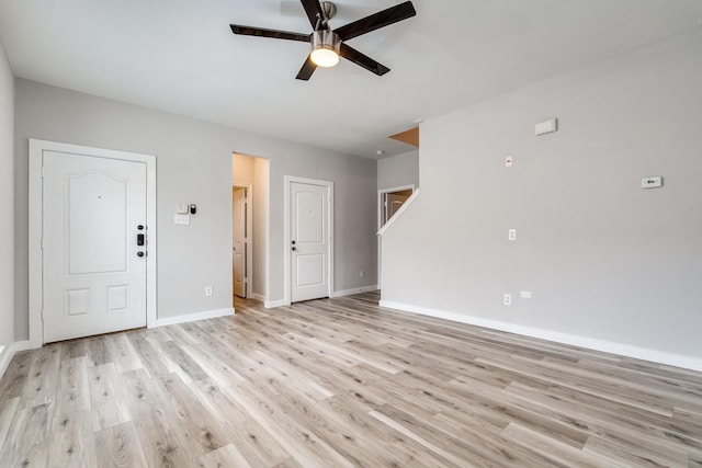 4007 Freedom St, Heartland, TX 75126 - unfurnished living room with ceiling fan, light wood-style floors, and baseboards