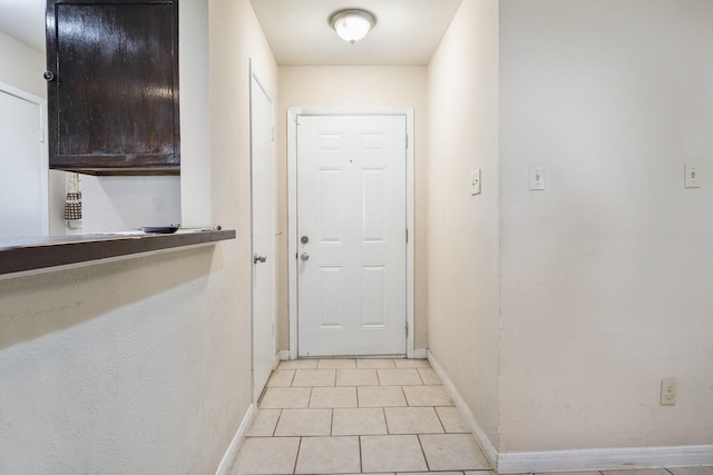 6341 Leaning Oaks St, Dallas, TX 75241 - doorway with baseboards and light tile patterned flooring