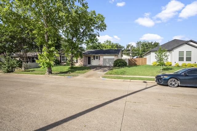 6341 Leaning Oaks St, Dallas, TX 75241 - view of front of house featuring an attached garage and driveway