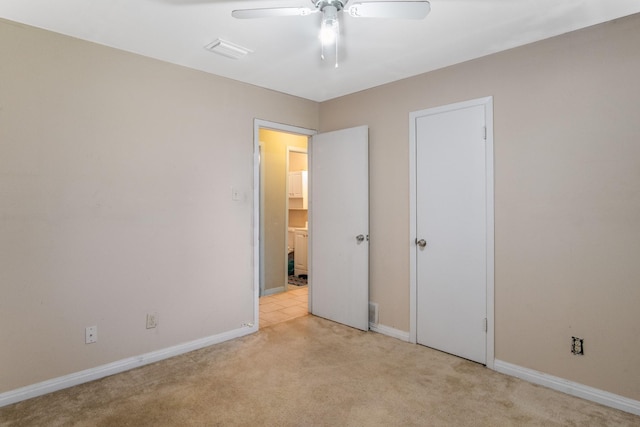 6341 Leaning Oaks St, Dallas, TX 75241 - unfurnished bedroom featuring light colored carpet, baseboards, and ceiling fan