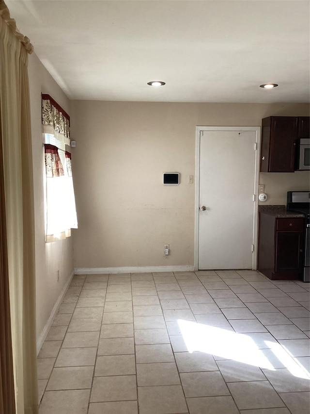 6341 Leaning Oak St, Dallas, TX 75241 - empty room with light tile patterned floors, baseboards, and recessed lighting